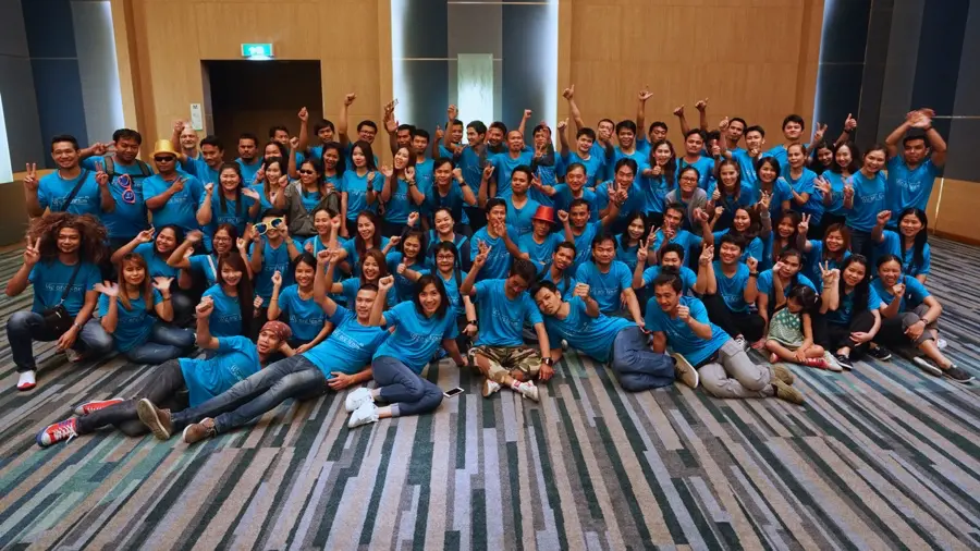 Company outing group photo in a Bangkok hotel ballroom