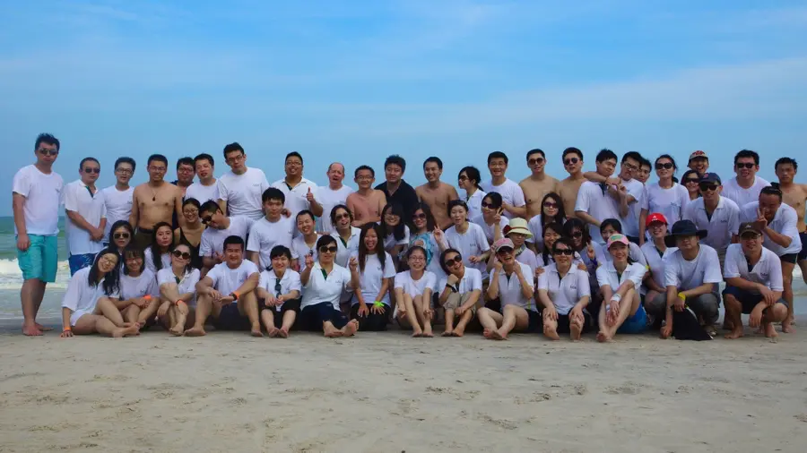 Corporate group celebrating on a beach in Thailand