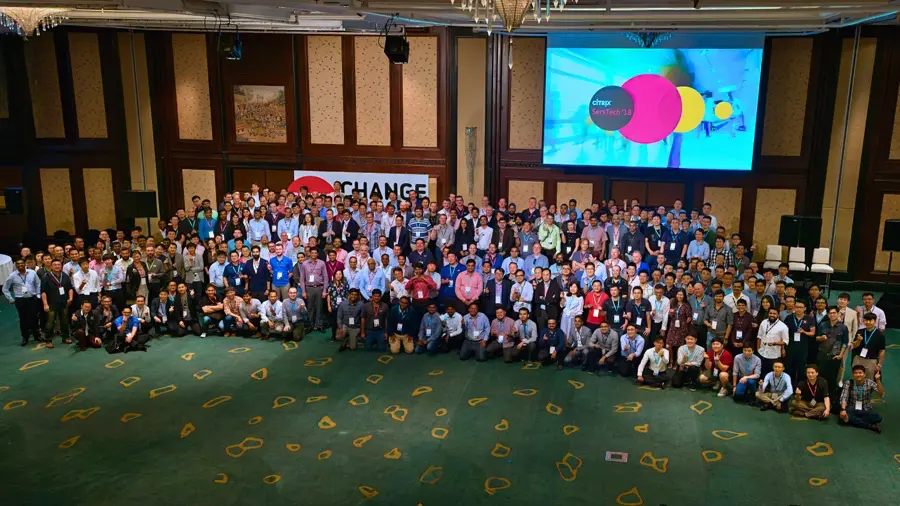 Large corporate conference group photo in a Bangkok ballroom
