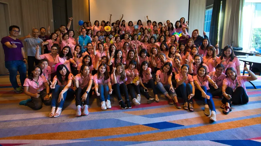 Staff team bonding celebration with balloons in Bangkok