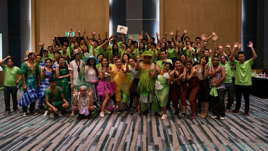 Corporate group celebrating a CSR-themed team building activity in Bangkok