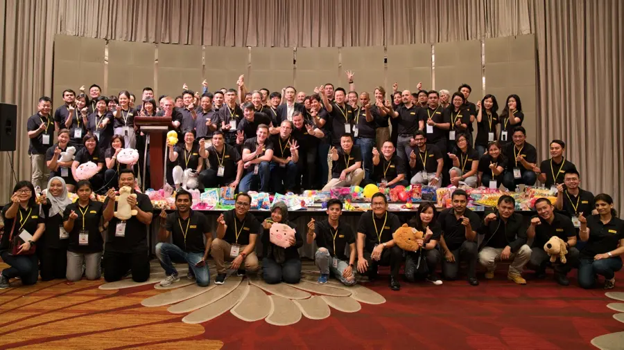Group team photo after a charity team building activity in Bangkok