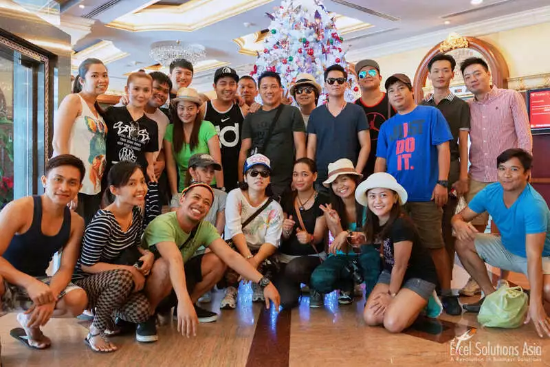 Event group image in front of a Christmas tree