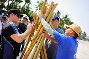 Teams build a raft with bamboo