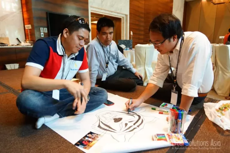 Teams design logos on a fashion team building corporate event
