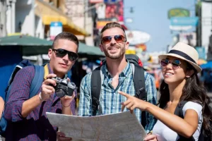 A group of individuals using a map and searching for a location during a photo clue hunt in an engaging Bangkok outdoor activity