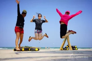 Winning team members celebrating on a beach in Hua Hin, Thailand